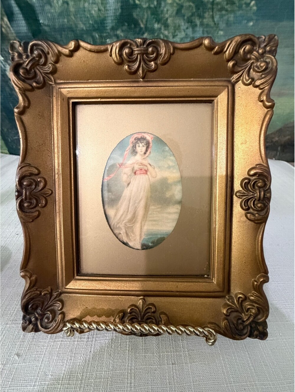 Ornate gold framed angel print